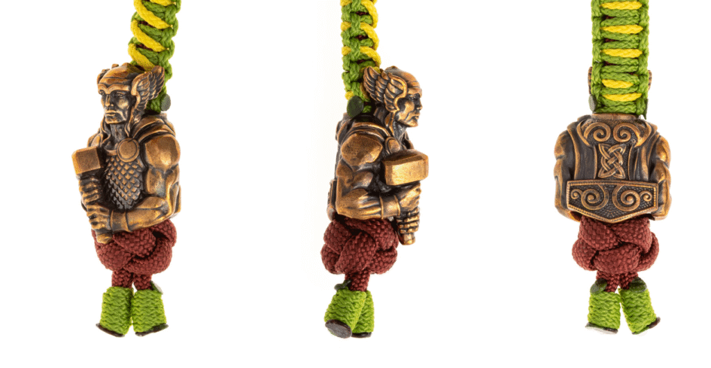 Full body Thor figure holding Mjolnir hammer with Celtic armor patterns, high-quality paracord beads for EDC DIY projects.