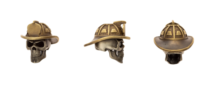 Bronze skull wearing a fireman helmet, durable beads for paracord projects and survival gear accessories.