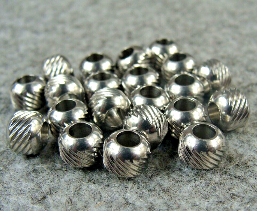 Stainless steel paracord beads with chamfered holes in various sizes on 550 paracord cord