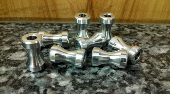 Titanium paracord beads manufactured by CNC machining process with perfect bore tolerances for EDC lanyards