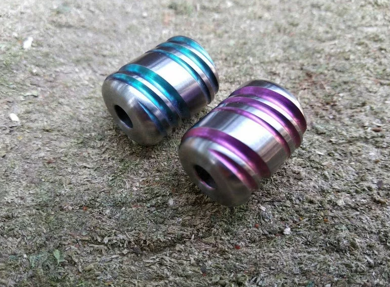 Close-up of CNC machined paracord beads showing micron-level dimensional accuracy and surface finish quality
