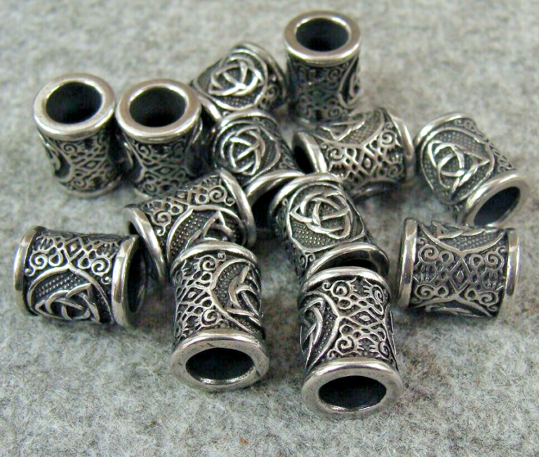 Stainless steel lanyard beads with bead-blasted, brushed, and mirror finishes side by side