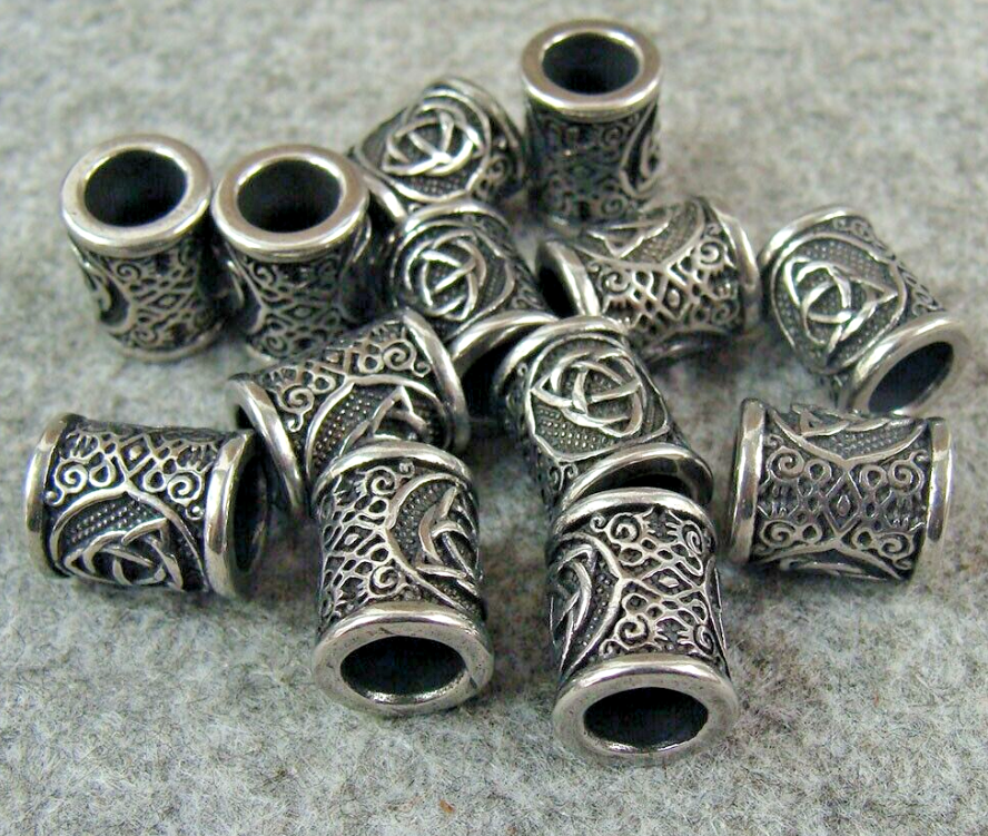 Stainless steel lanyard beads with bead-blasted, brushed, and mirror finishes side by side