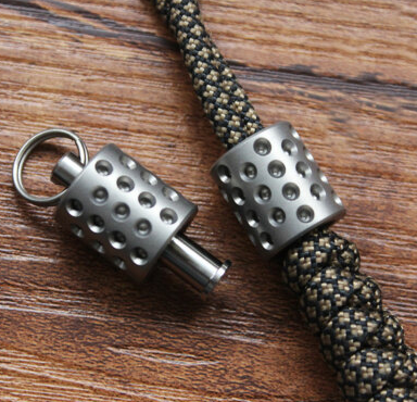 Flame anodizing zirconium bead with torch showing color transformation from silver to blue-purple oxide layer