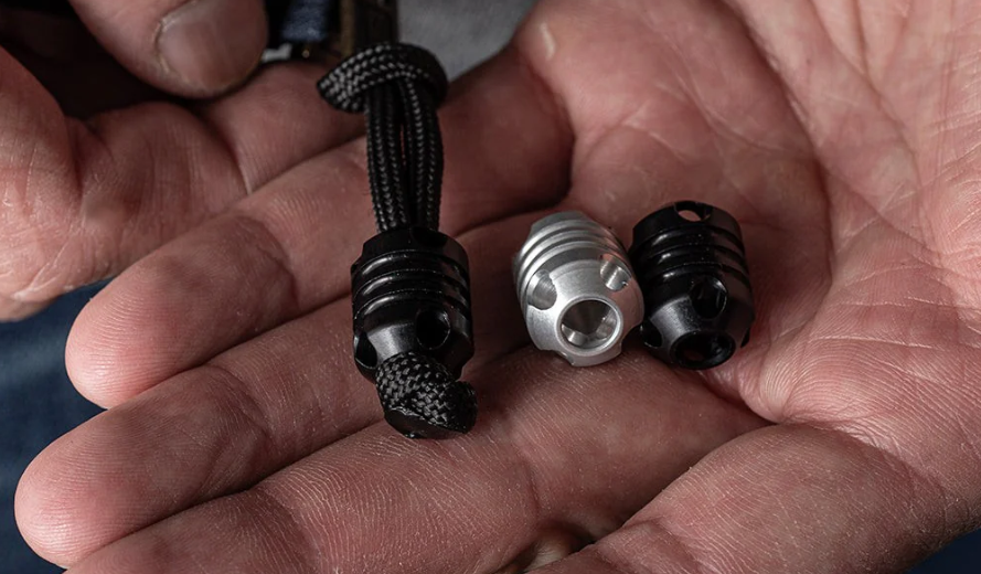 Metal beads for paracord in various finishes demonstrating CNC machining superiority over cast alternatives
